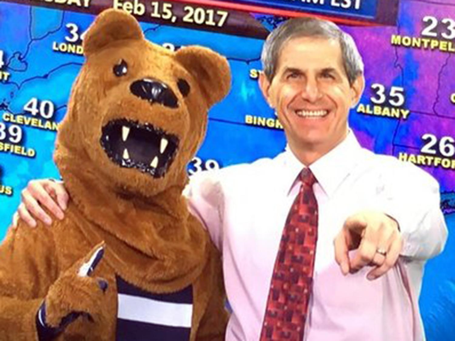 Jon Nese with the Nittany Lion Mascot in front of a digital weather map showing temps in the northeast U.S.